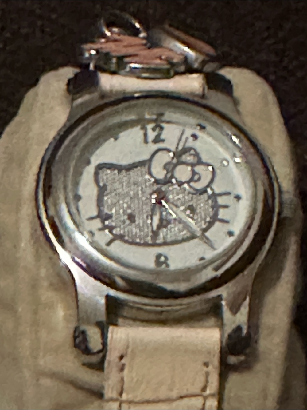 Hello Kitty Women’s Silver-Tone Watch with Cream Strap. Very Good condition.